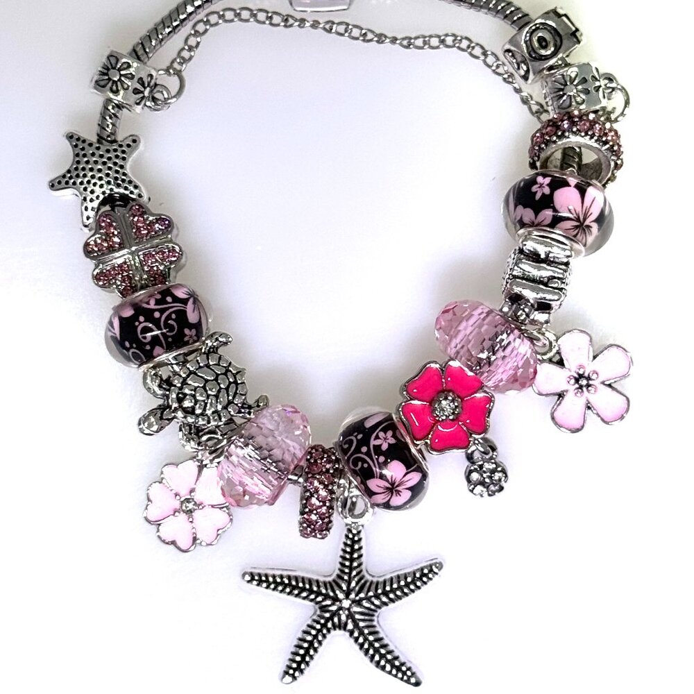 Pink crystal silver tone slide charm bracelet, lots of charms, Ocean theme, NWOT